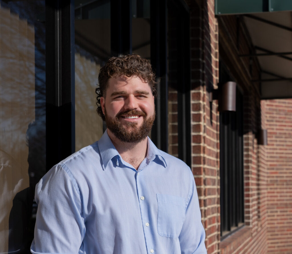 Dr. Korrin Taylor standing outside his chiropractic clinic