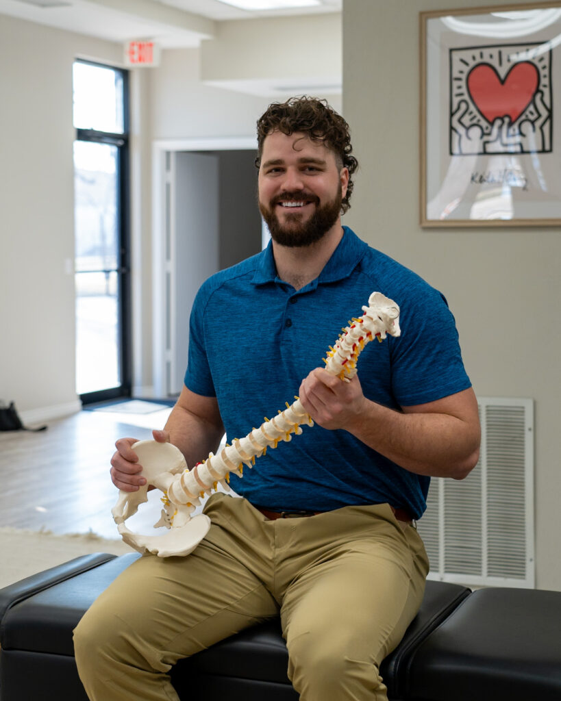 Doctor Korrin greeting patients at Vita Nova Chiropractic