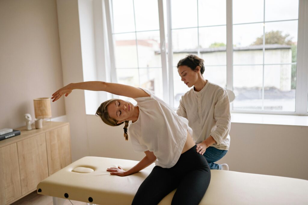 Chiropractor performing gentle adjustment for back pain relief in a bright office