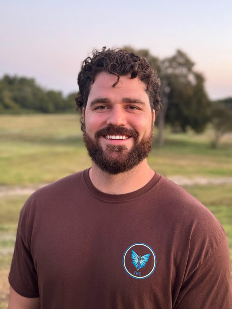 Dr. Korrin Taylor smiling in a field, promoting $49 chiropractic special at Vita Nova Chiropractic in Plano, TX