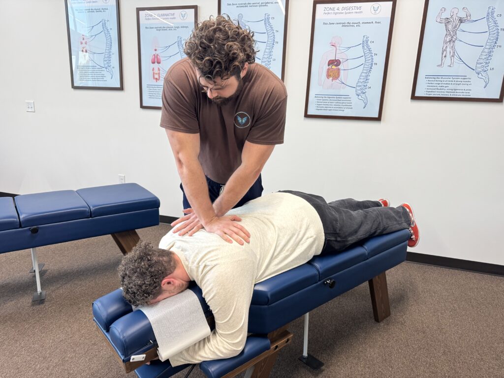 Chiropractor at Vita Nova Chiropractic in Plano, TX providing gentle spinal adjustment to help reduce fibromyalgia pain, improve mobility, and support nervous system function naturally