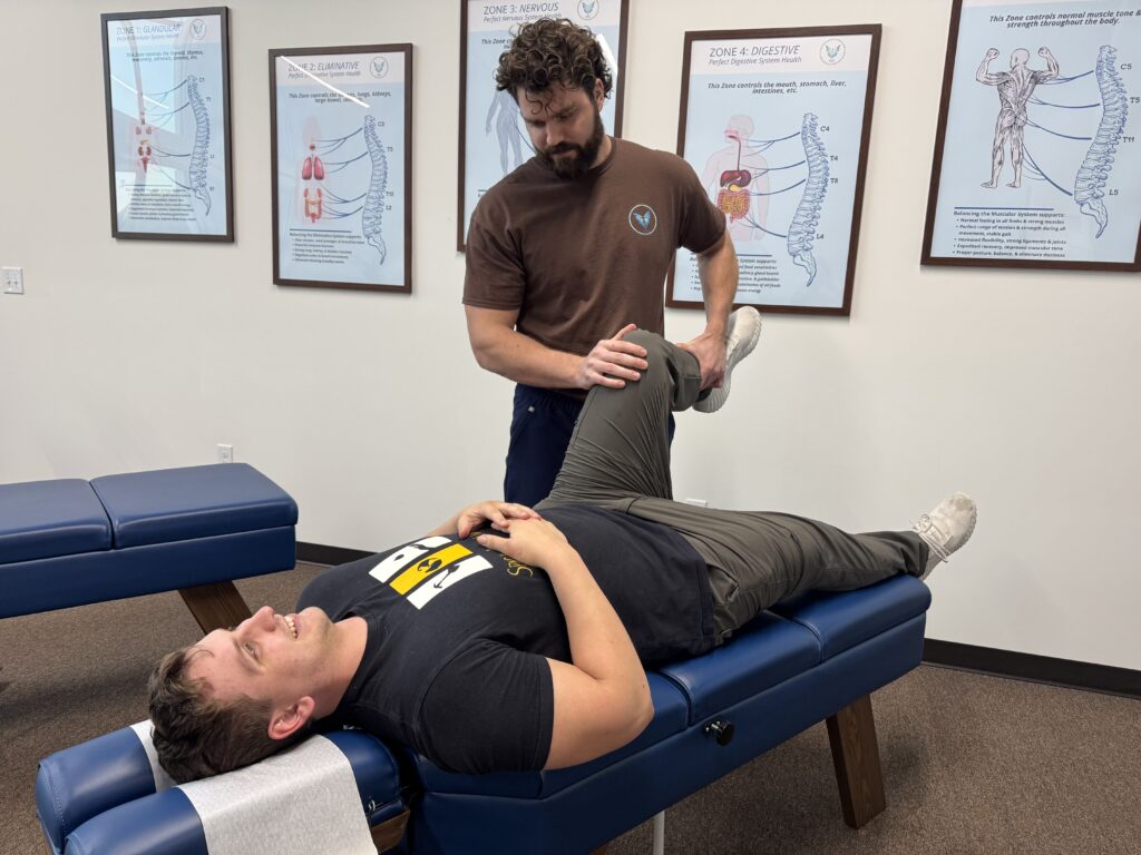 Chiropractor at Vita Nova Chiropractic in Plano, TX providing targeted adjustment to help relieve bursitis pain, reduce inflammation, and restore joint mobility naturally