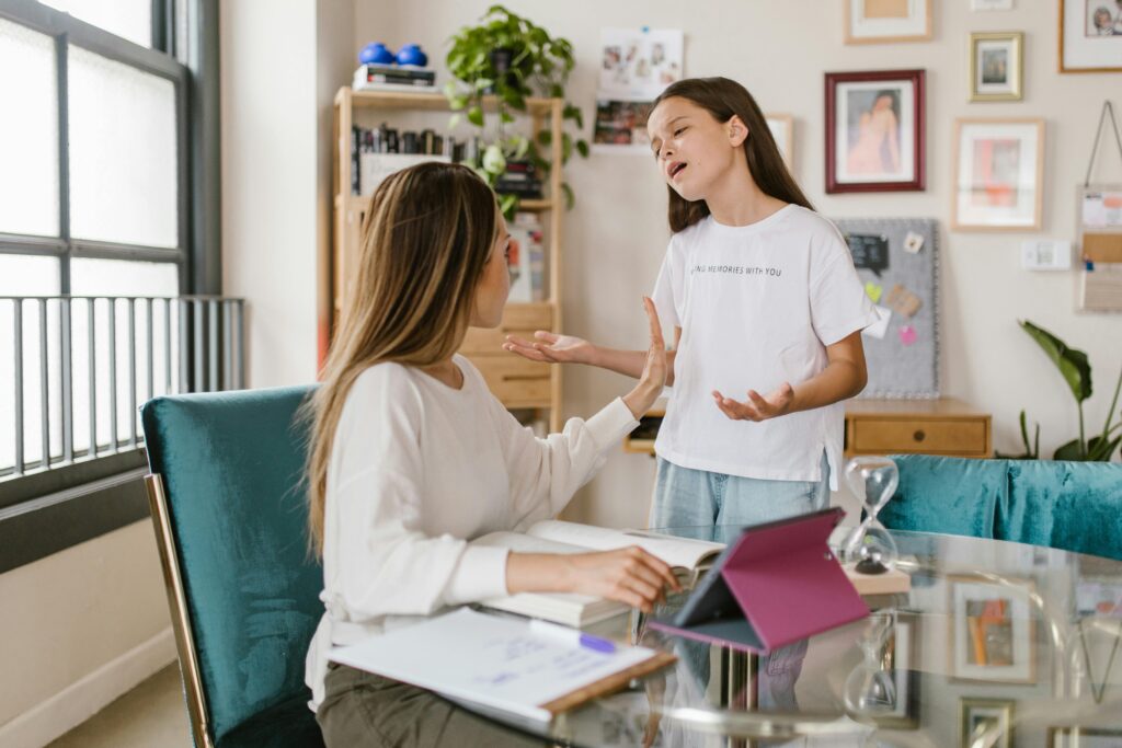 Mother talking with child during a pediatric ADHD support consultation at home
