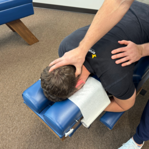 Dr. Korrin performing Zone Technique assessment at Vita Nova Chiropractic in Plano, TX