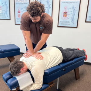 Dr. Korrin providing holistic chiropractic care at Vita Nova Chiropractic in Plano, TX