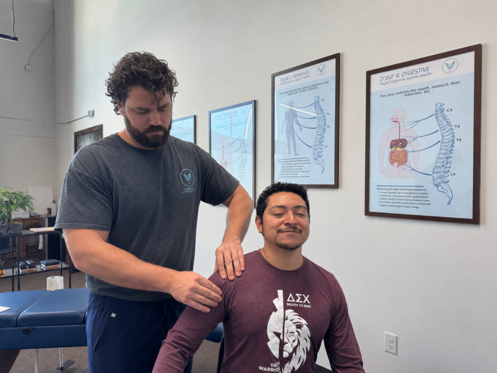 Dr. Korrin Taylor provides rotator cuff chiropractic care for a patient at Vita Nova Chiropractic in Plano TX